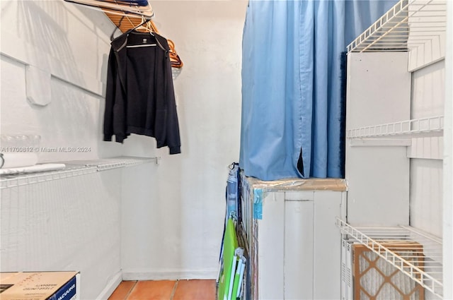 spacious closet featuring tile patterned floors