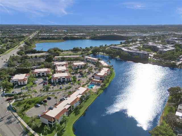 1104 N Hiatus Rd Unit 1104, Pembroke Pines, FL 33026 - bedroom with access to exterior, baseboards, carpet flooring, a ceiling fan, and a textured ceiling