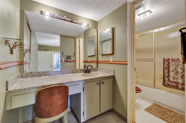 full bathroom featuring shower / bath combination with glass door, vanity, a textured ceiling, and toilet