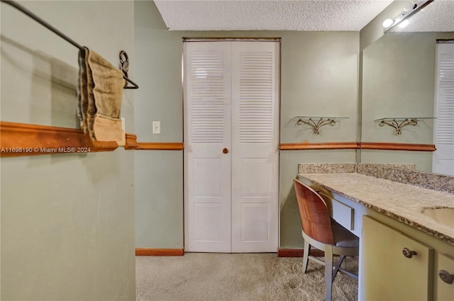 bathroom featuring vanity and a textured ceiling