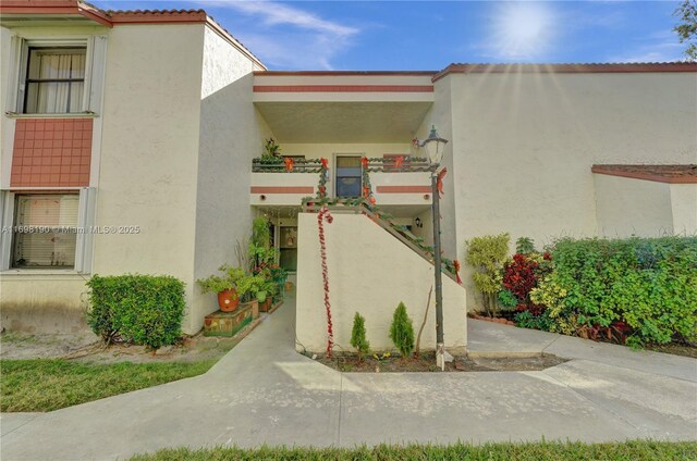 1104 N Hiatus Rd Unit 1104, Pembroke Pines, FL 33026 - bedroom featuring carpet flooring, ceiling fan, a textured ceiling, and baseboards