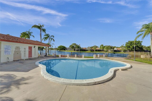 1104 N Hiatus Rd Unit 1104, Pembroke Pines, FL 33026 - community pool with a water view and a patio