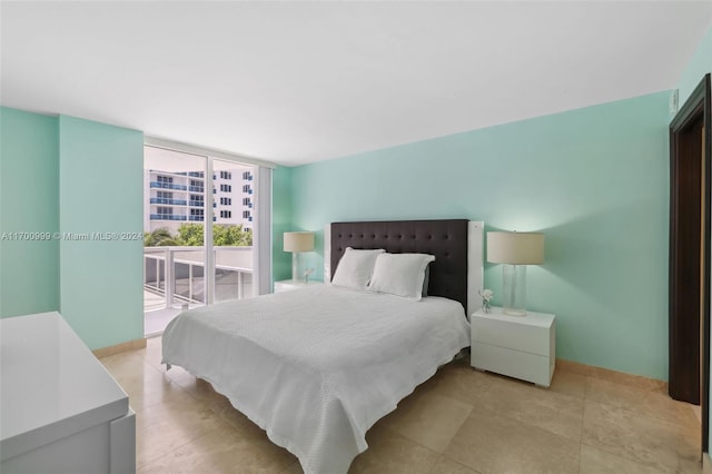 bedroom featuring access to outside and expansive windows