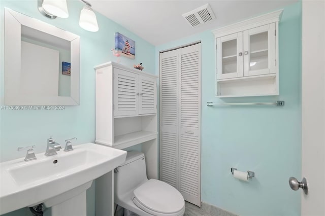 bathroom featuring sink and toilet