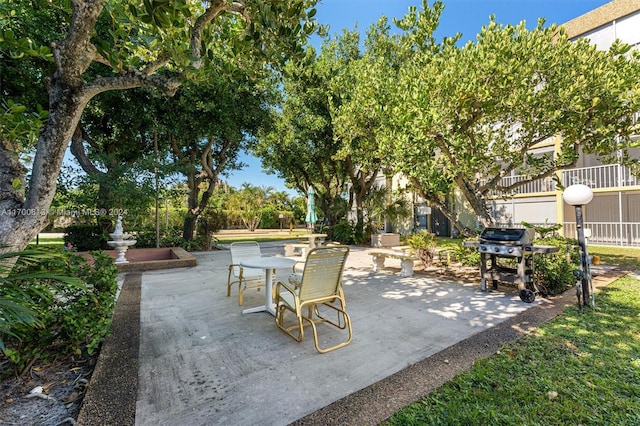 view of patio featuring a grill