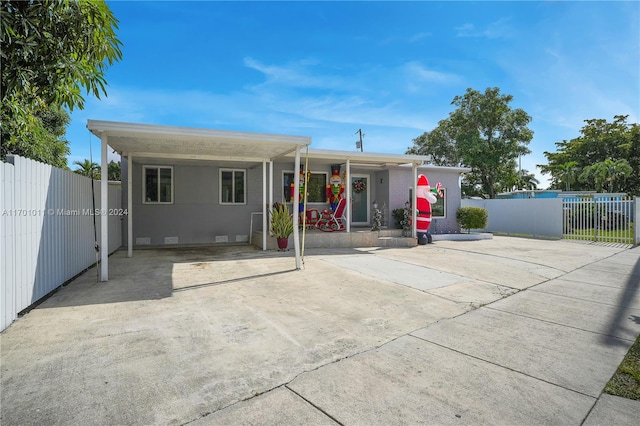 view of front of property featuring a carport