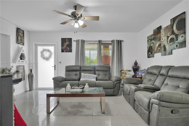 living room featuring ceiling fan and light tile patterned flooring