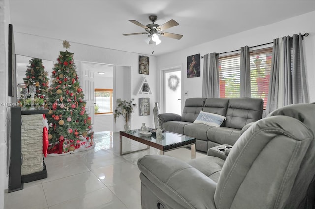 living room featuring ceiling fan and light tile patterned flooring