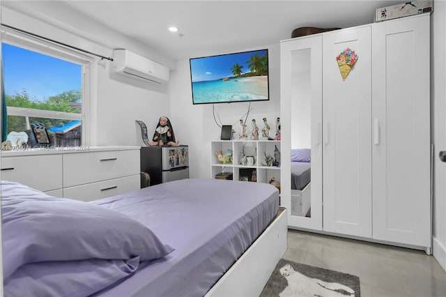 bedroom with a wall mounted AC and light tile patterned floors