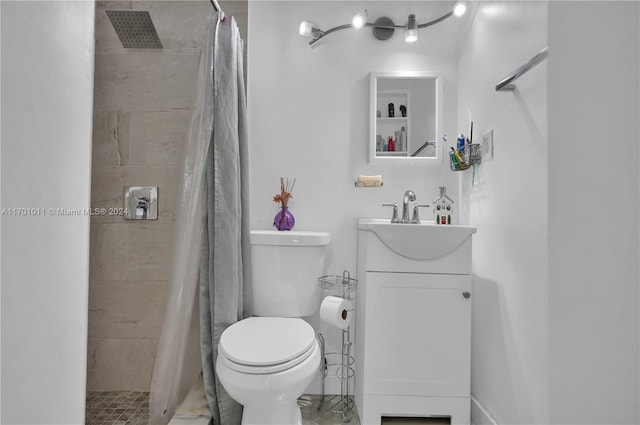 bathroom featuring vanity, a shower with shower curtain, and toilet