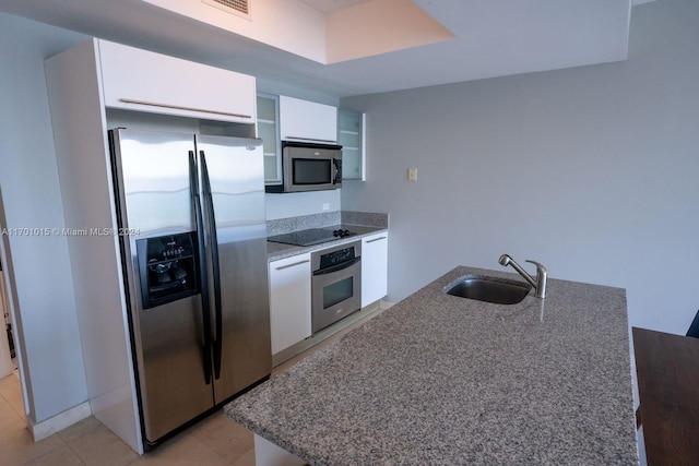 kitchen with sink, white cabinets, and stainless steel appliances