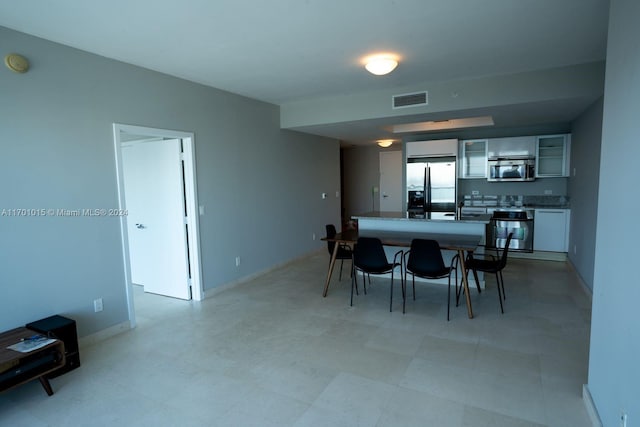 888 Biscayne Blvd Unit 3806, Miami, FL 33132 - dining space featuring baseboards