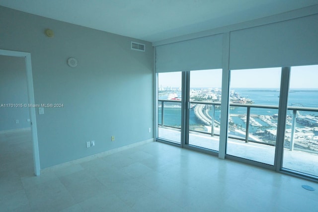 888 Biscayne Blvd Unit 3806, Miami, FL 33132 - empty room with a water view, floor to ceiling windows, and light flooring