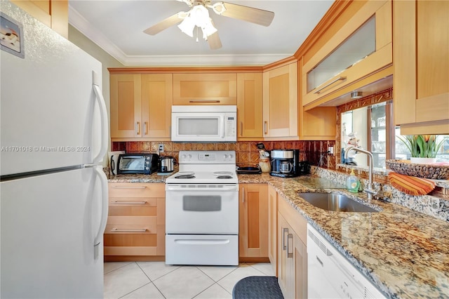 kitchen with sink, light stone counters, white appliances, light tile patterned floors, and ornamental molding