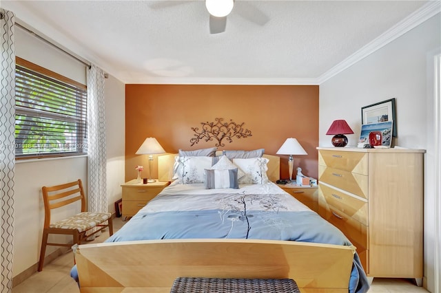 bedroom with ceiling fan, ornamental molding, a textured ceiling, and light tile patterned floors