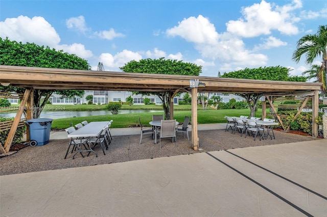 view of patio with a water view