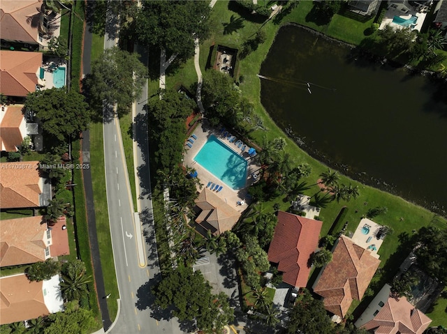 birds eye view of property with a water view