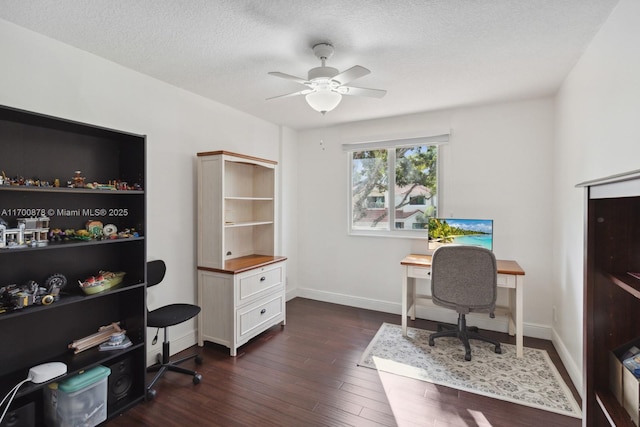 office space featuring ceiling fan, dark hardwood / wood-style floors, and a textured ceiling