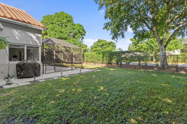 view of yard featuring a lanai