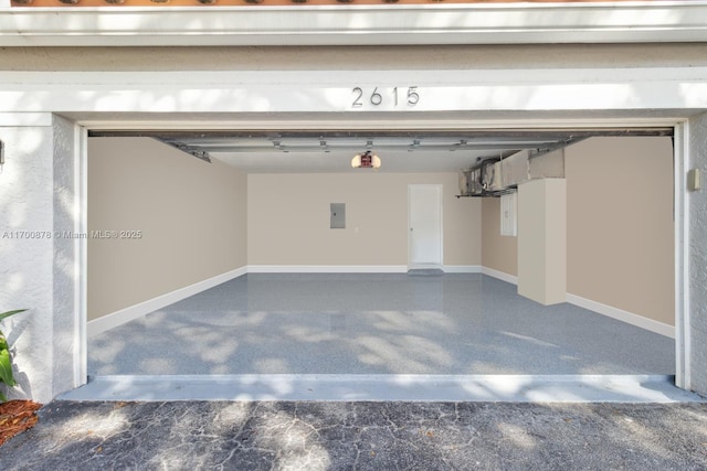 garage featuring a garage door opener and electric panel