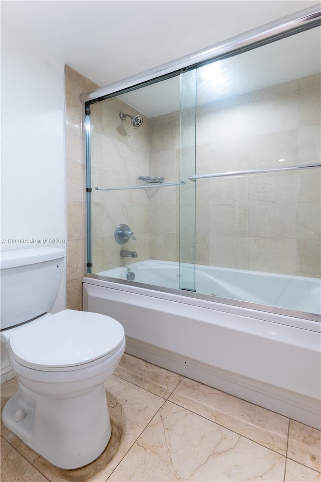 bathroom featuring toilet and enclosed tub / shower combo