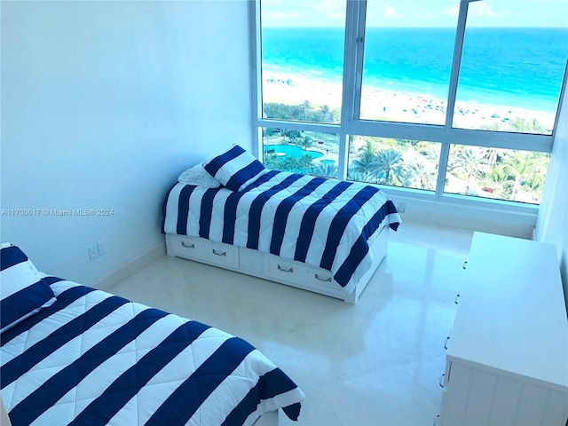 bedroom featuring a water view