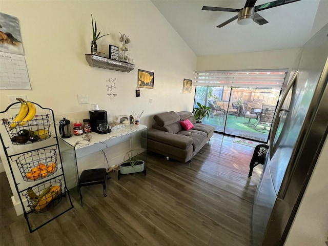 living room featuring ceiling fan, dark hardwood / wood-style flooring, and vaulted ceiling