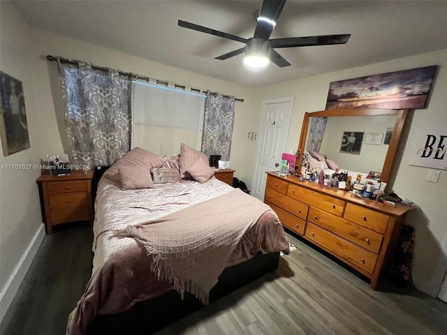 bedroom with ceiling fan and hardwood / wood-style floors