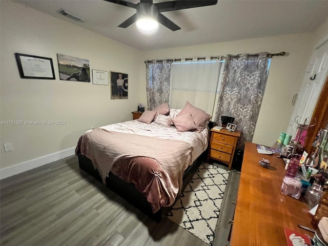 bedroom with hardwood / wood-style floors and ceiling fan