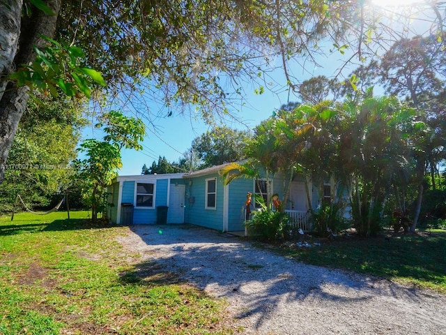 view of front of home with a front lawn and a porch