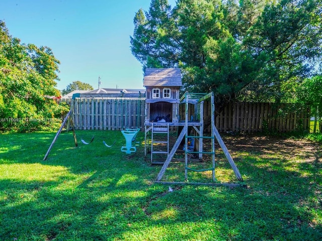 view of jungle gym with a lawn