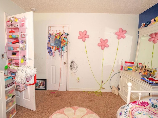 carpeted bedroom featuring a textured ceiling