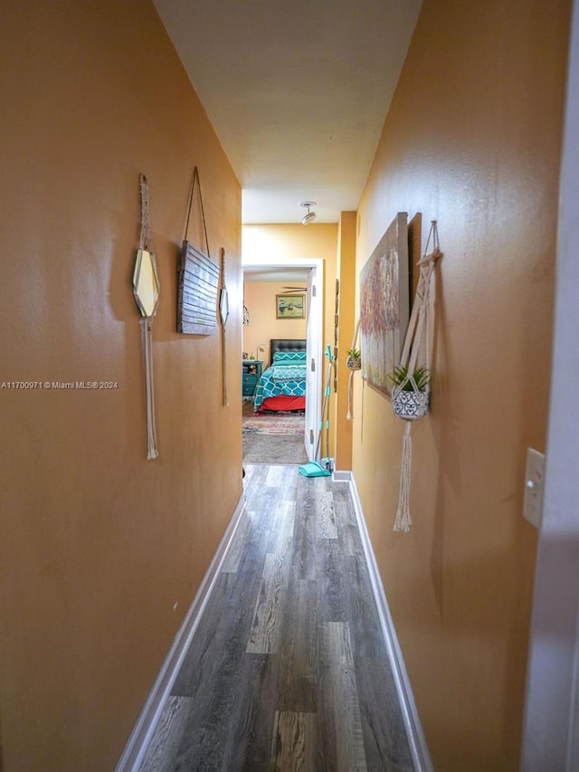 hall with hardwood / wood-style floors