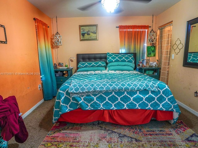 bedroom featuring ceiling fan and carpet