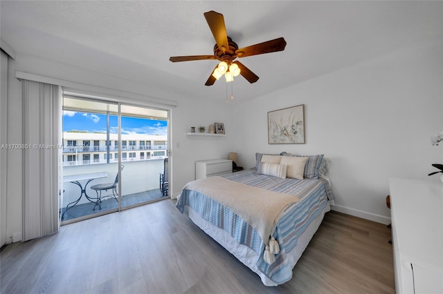 bedroom with access to exterior, ceiling fan, and light wood-type flooring