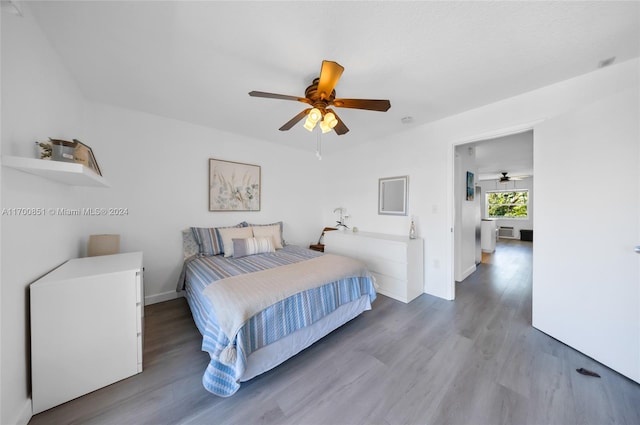 bedroom featuring ceiling fan and wood-type flooring