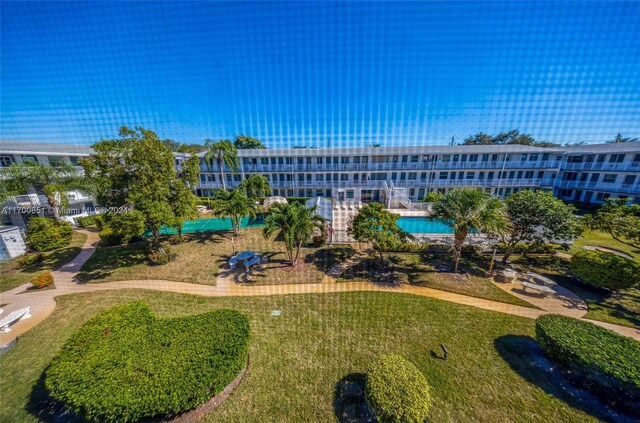 15610 NE 6th Ave Unit 33D, Miami, FL 33162 - surrounding community featuring a lawn