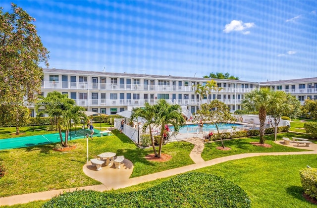 15610 NE 6th Ave Unit 33D, Miami, FL 33162 - view of property's community with a yard and a swimming pool