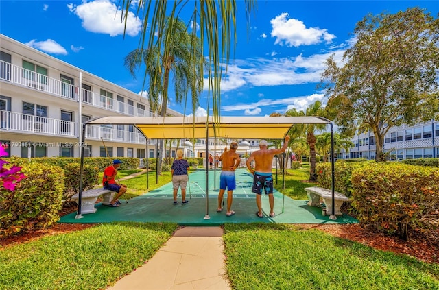 view of jungle gym featuring a lawn