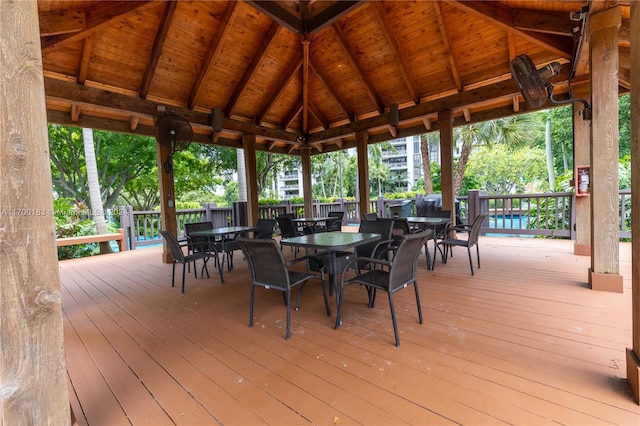 wooden terrace featuring a gazebo