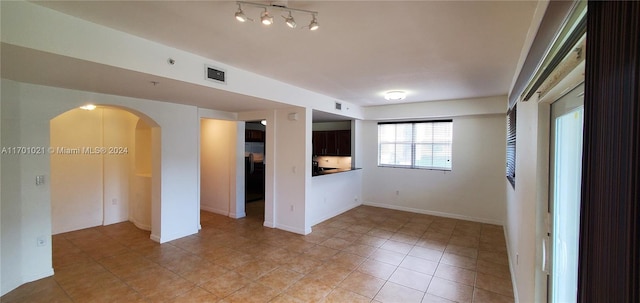 view of tiled spare room