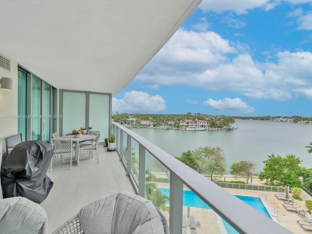 balcony featuring a water view