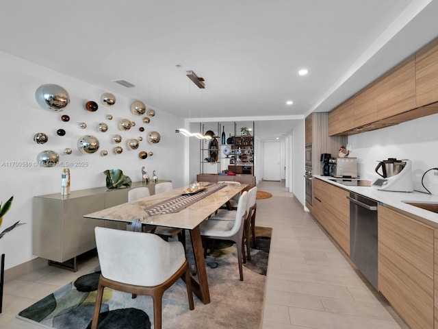 dining space featuring recessed lighting and visible vents