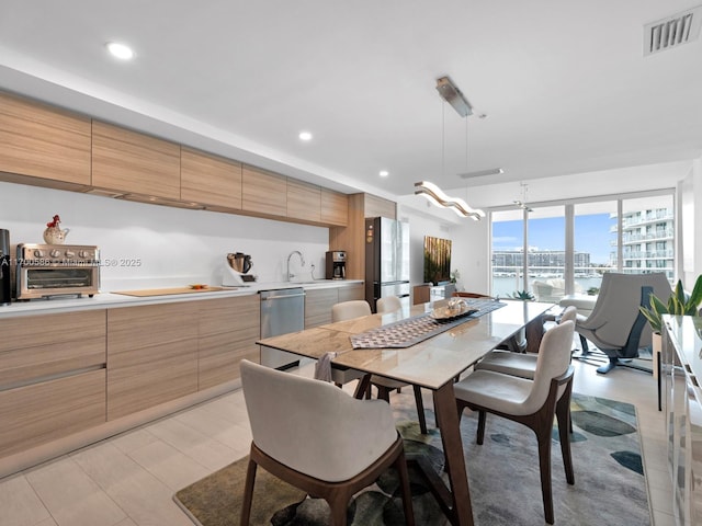 dining room featuring a toaster, visible vents, and recessed lighting