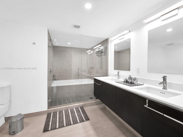 full bathroom with tile patterned floors, vanity, independent shower and bath, and toilet