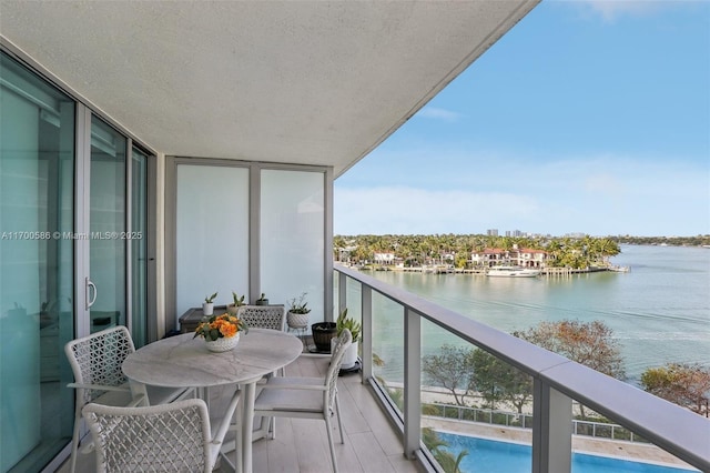 balcony featuring a water view