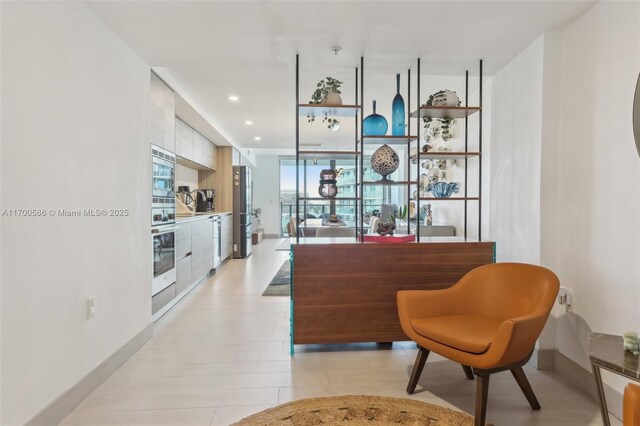 living area featuring light hardwood / wood-style floors and indoor bar