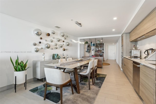 dining space featuring light hardwood / wood-style flooring