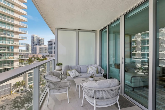 balcony with a sunroom and a city view