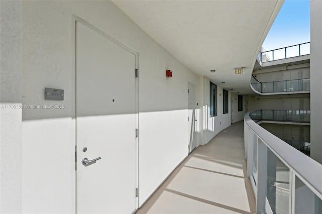 corridor with a skylight and concrete floors